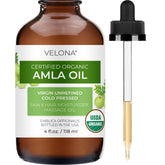 Velona Amla Huile dans sa bouteille prête à une application capillaire nourrissante.
