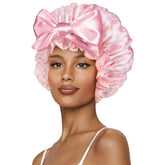 Bonnet Vettres satin rose avec nœud blanc, protège les cheveux pendant le sommeil.