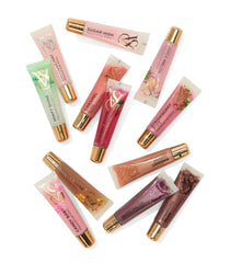 Ensemble de rouges à lèvres Victoria's Secret gloss variés, brillance subtile.