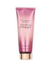 Victoria's Secret Strawberries & Champagne lotion bottle with floral fruity fragrance for daily wear.