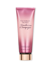 Victoria's Secret Strawberries & Champagne lotion bottle with floral fruity fragrance for daily wear.