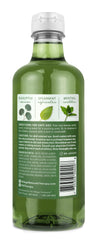 Pouring Village Naturals Therapy Muscle Foaming Bath Oil into warm water for a revitalizing bath