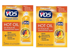 Vo5 Huile Chaude Thérapie Bouteille montrant l’hydratation capillaire.