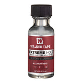 Walker Tape Extreme Hold avec brosse applicateur pour une pose précise le long de la ligne capillaire.