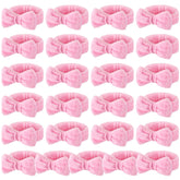 Bandeau visage Wavyknot rose corail, idéal pour le soin du visage.