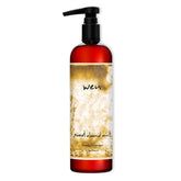 Bouteille rose de WEN par Chaz Dean montrant le soin tout-en-un pour cheveux hydratés et volumineux.