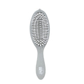 Brosse Wet Brush Go Green Charbon sur emballage, démontrant ses bénéfices démêlants.
