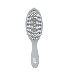 Brosse Wet Brush Go Green Charbon sur emballage, démontrant ses bénéfices démêlants.