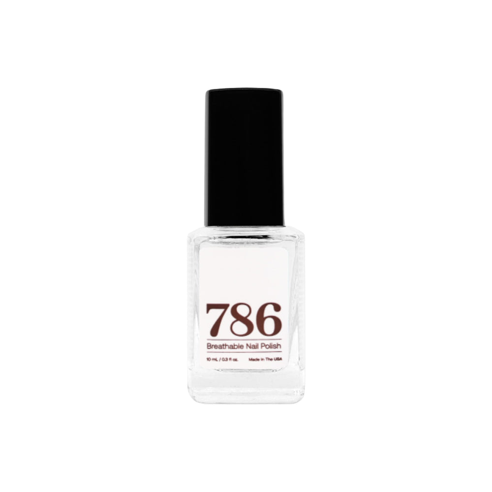 Vernis de finition transparent 786 Cosmetics, fini brillant et sec rapide pour des ongles soignés.