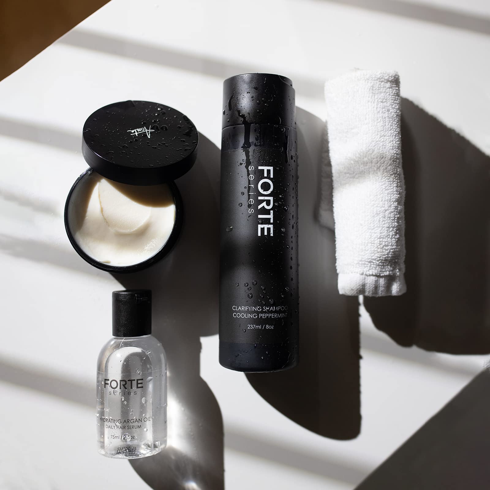 Alex Costa clarifying shampoo with conditioner pairing displayed for complete styling prep.