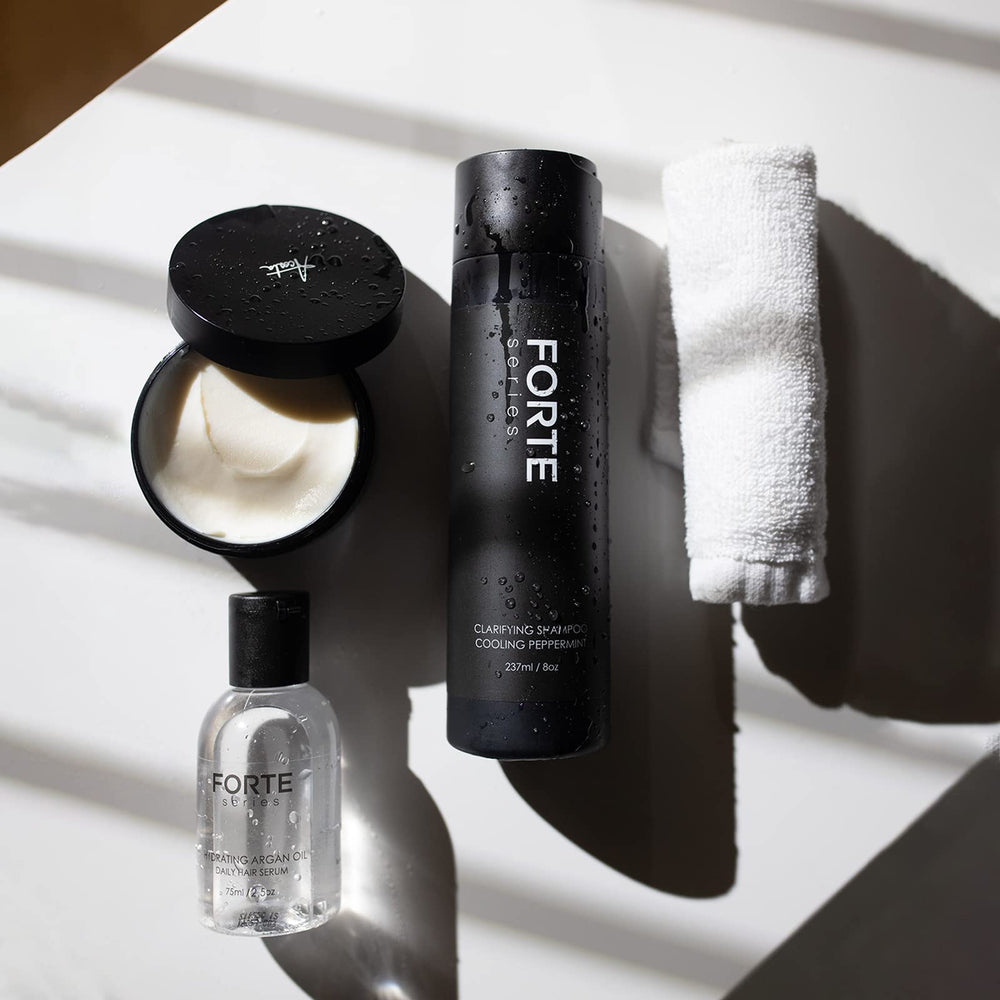 Alex Costa clarifying shampoo with conditioner pairing displayed for complete styling prep.