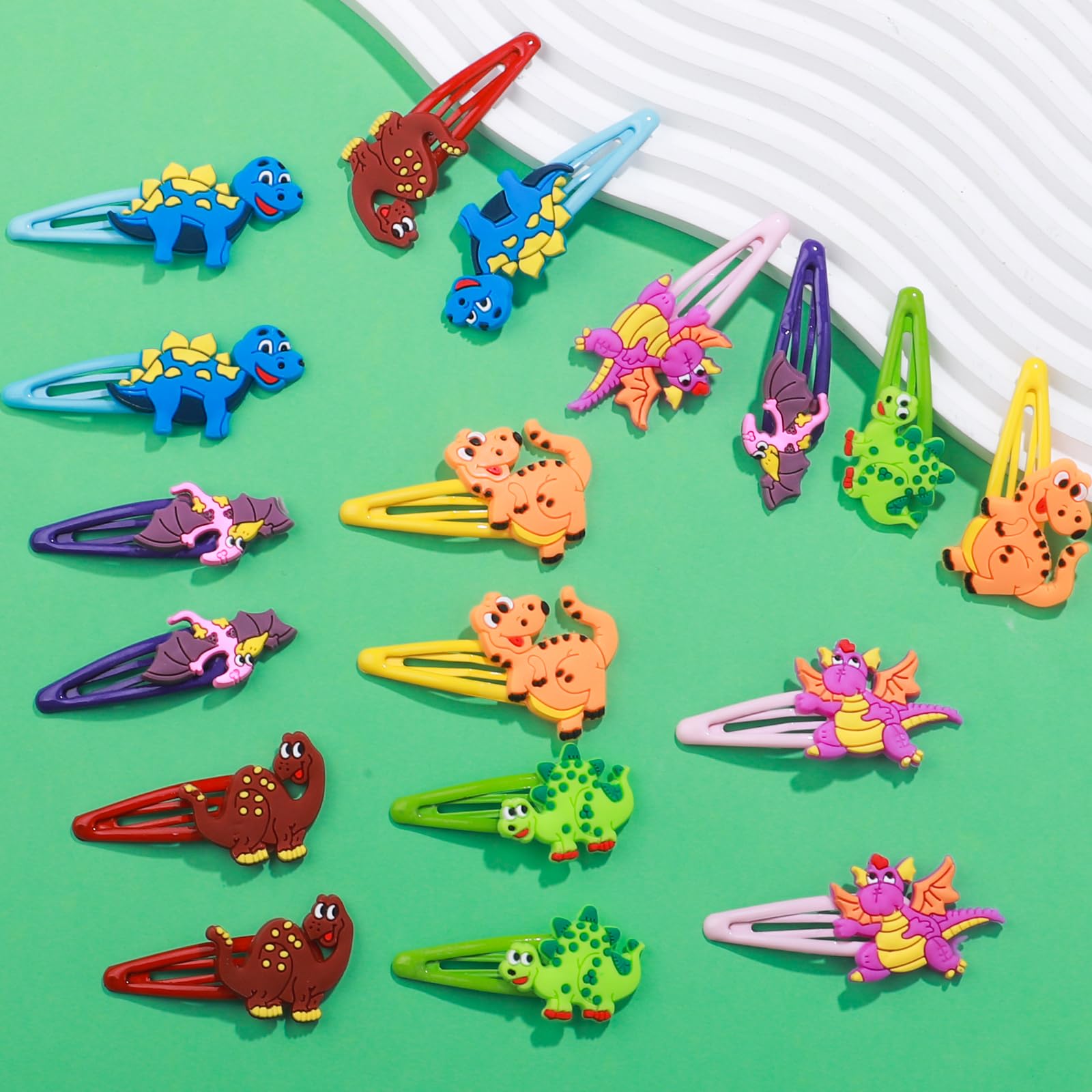 Barrettes dinosaure Alomois en silicone et métal, légère et robuste.