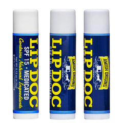 Lip Doc d'Amish Origins, tube visible, SPF15 pour lèvres protégées.