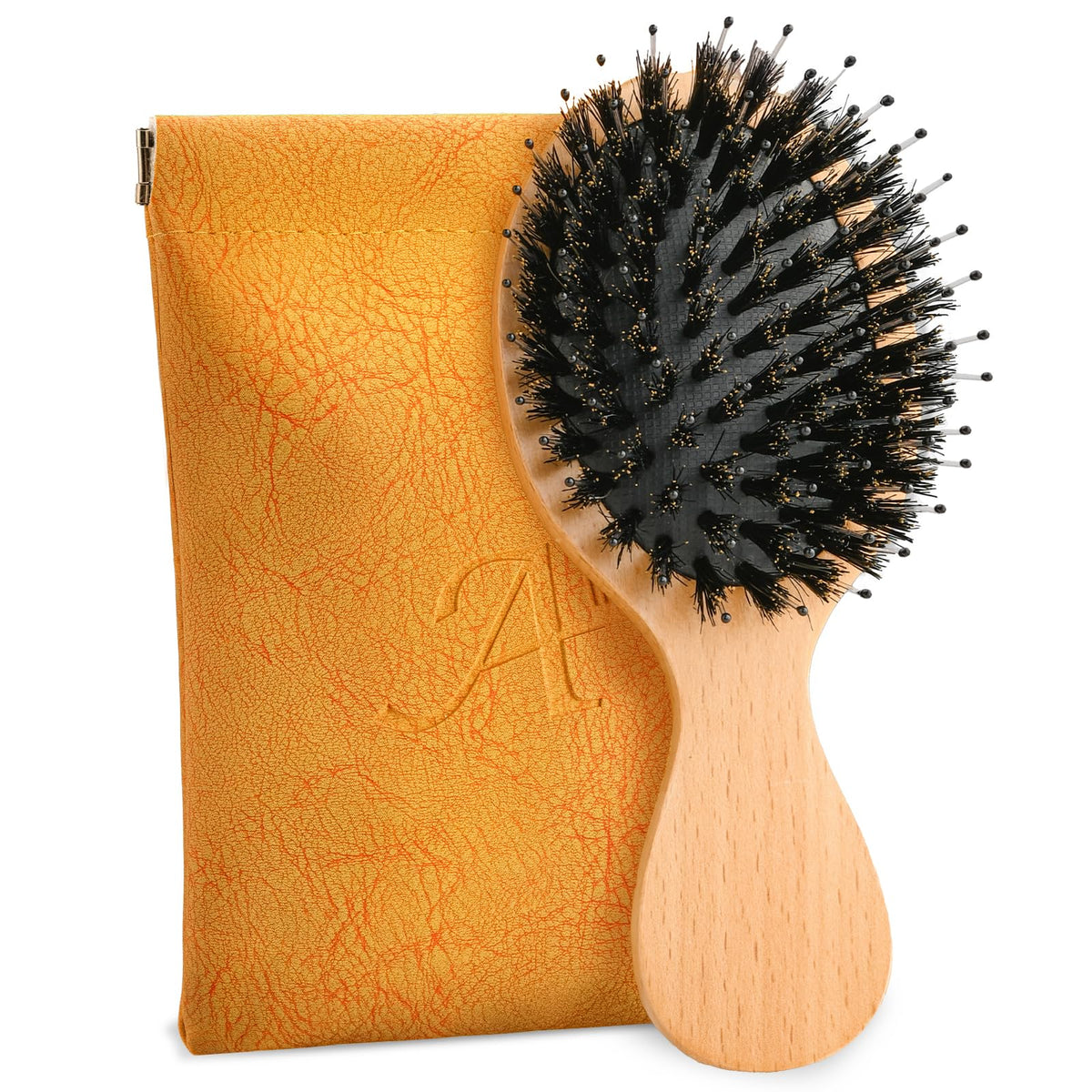 Ancable brosse-cheveux mini-portable: parfaite pour garder une coiffure soignée en déplacement.