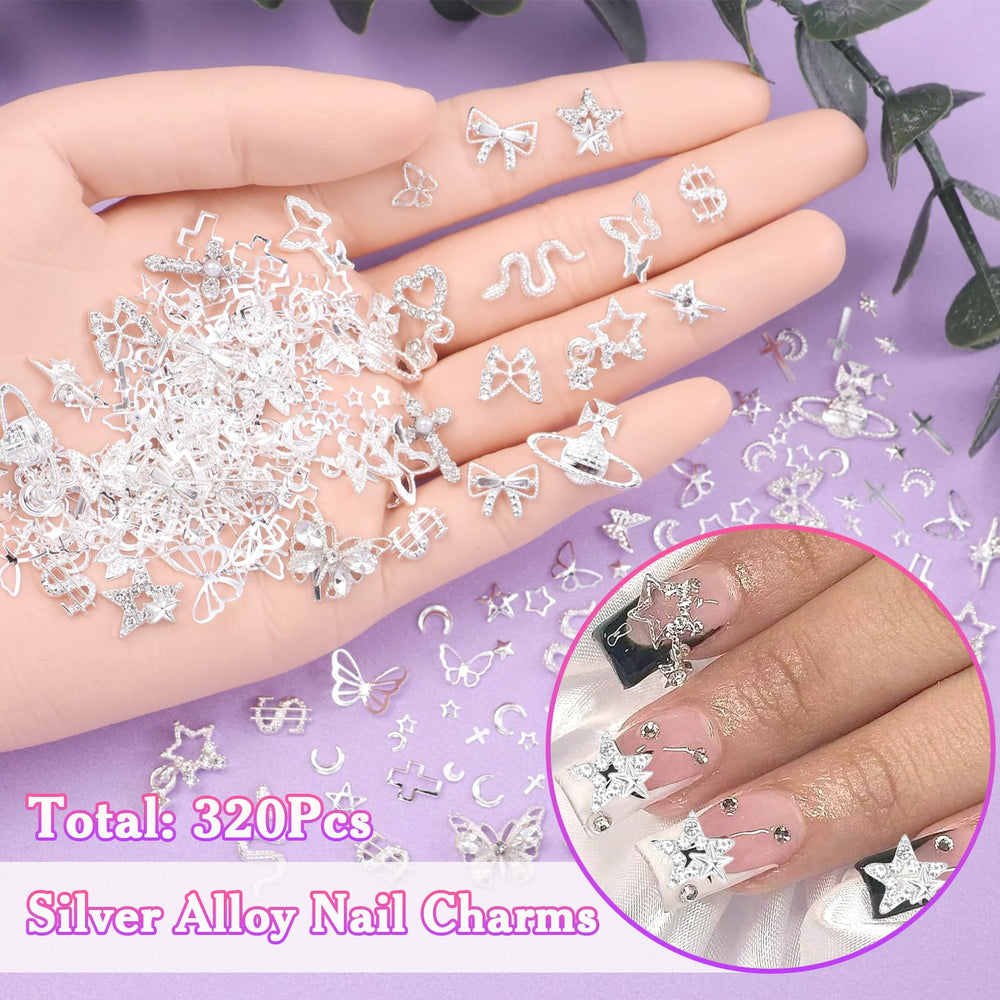 AnoleAir charmes argent planètes et pendentifs, allure contemporaine sur ongles.