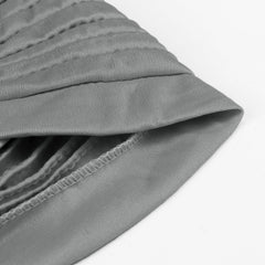 Vue arrière du turban AQOKKA montrant l elastique et l attache pre-faite.