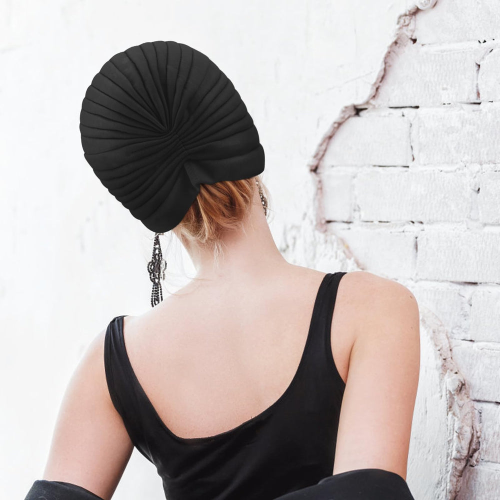 Dessin classique du turban AQOKKA avec noeud sur le dessus.