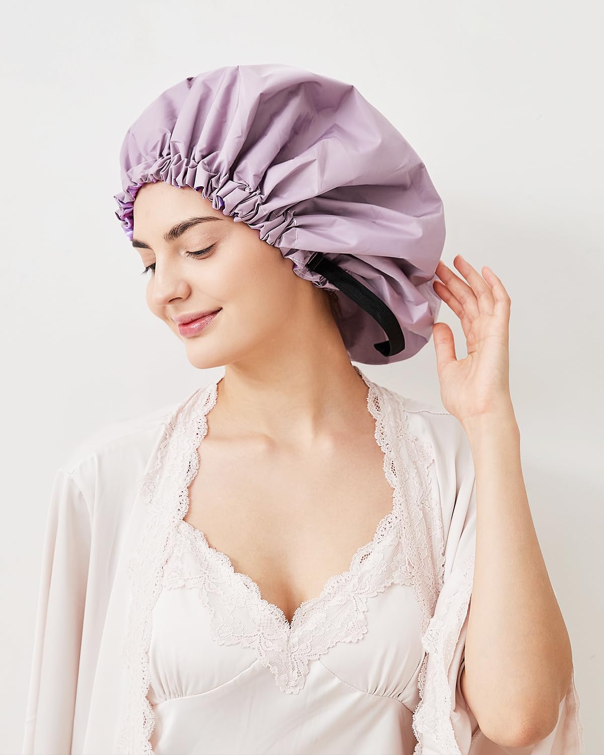 Aquior bonnet de douche avec élastique doux et cordon pour un ajustement sûr.