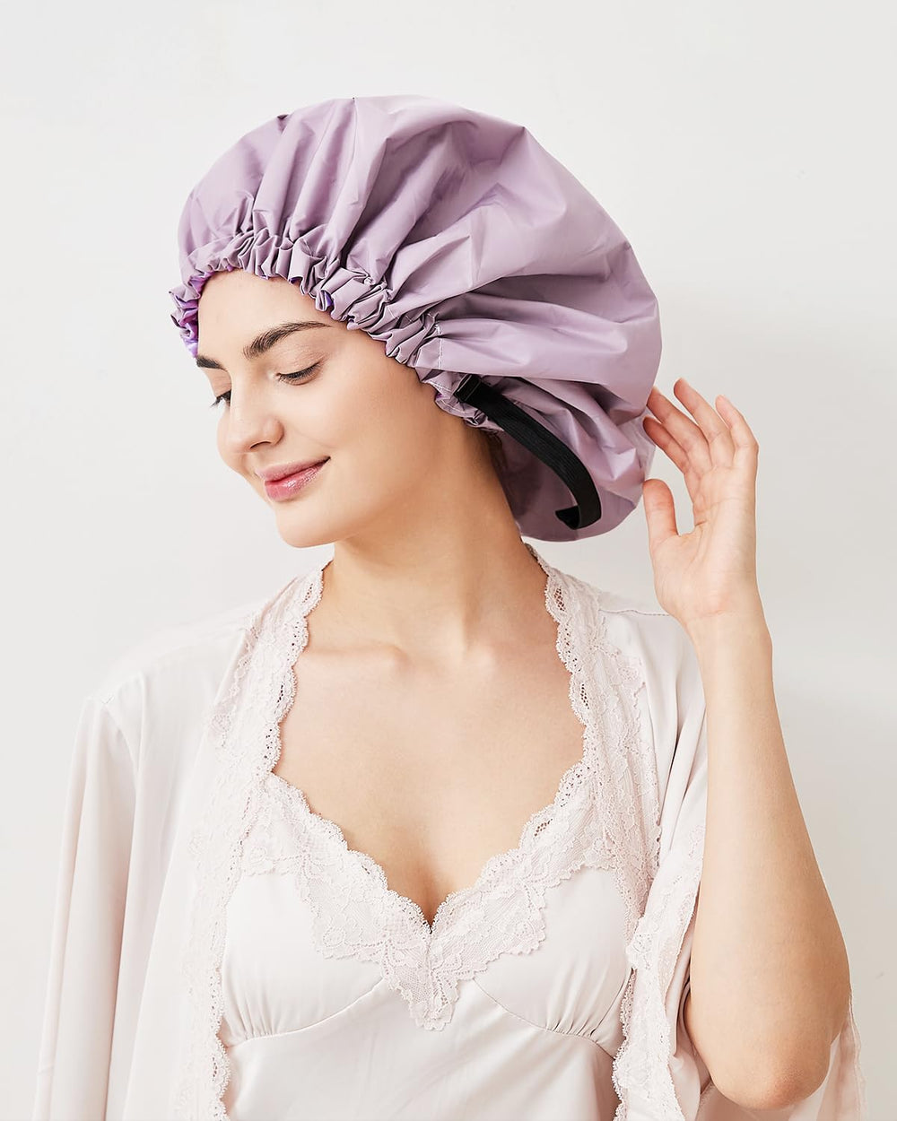 Aquior bonnet de douche avec élastique doux et cordon pour un ajustement sûr.