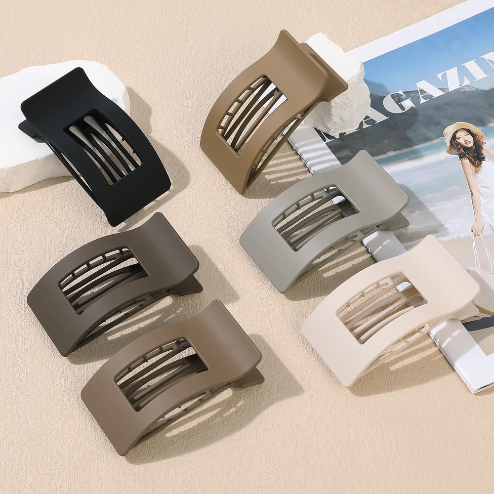 Pince Artchita à cheveux plats gris, design mat et tenue anti-dérapante.