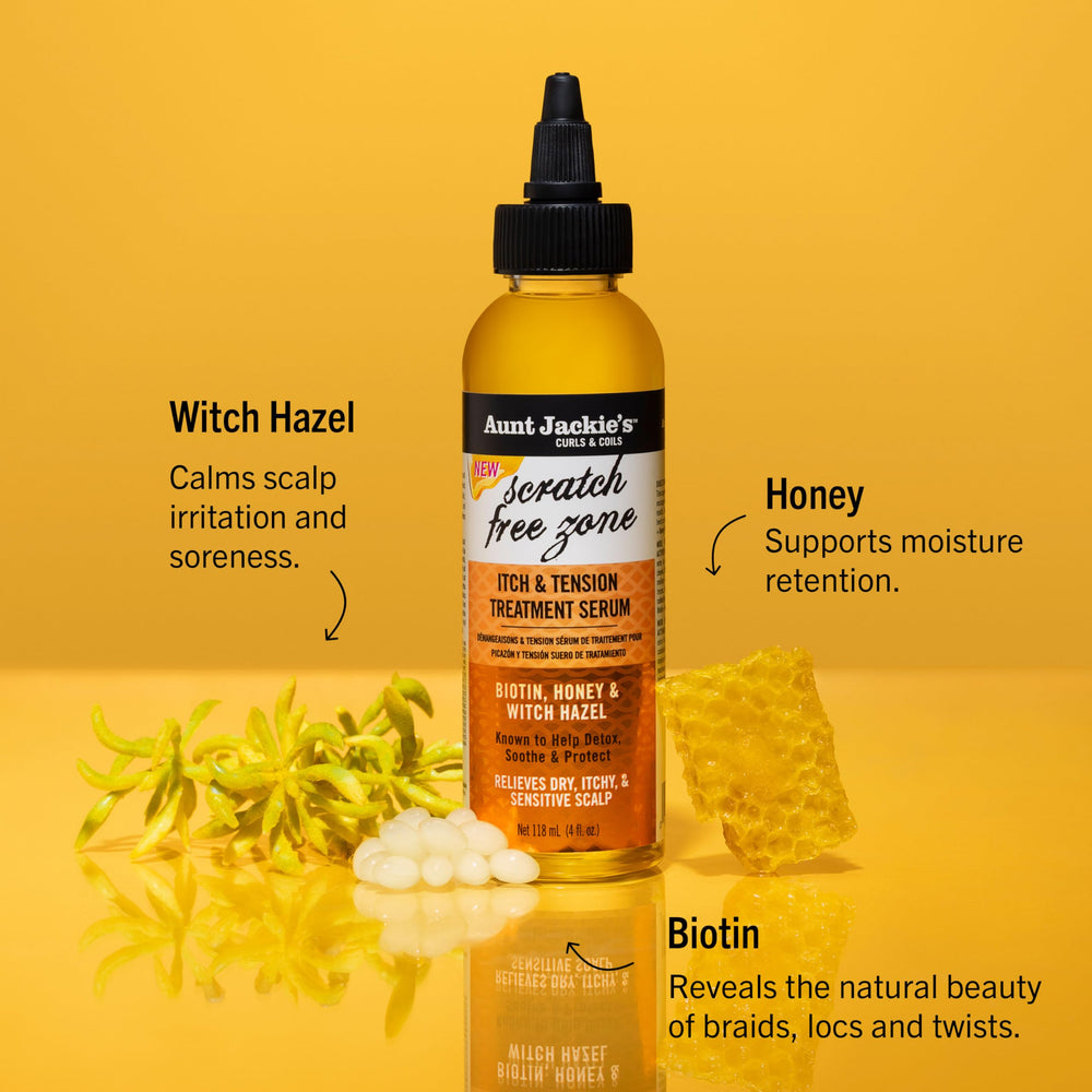 Application entre les raies du cuir chevelu avec le sérum Aunt Jackie's