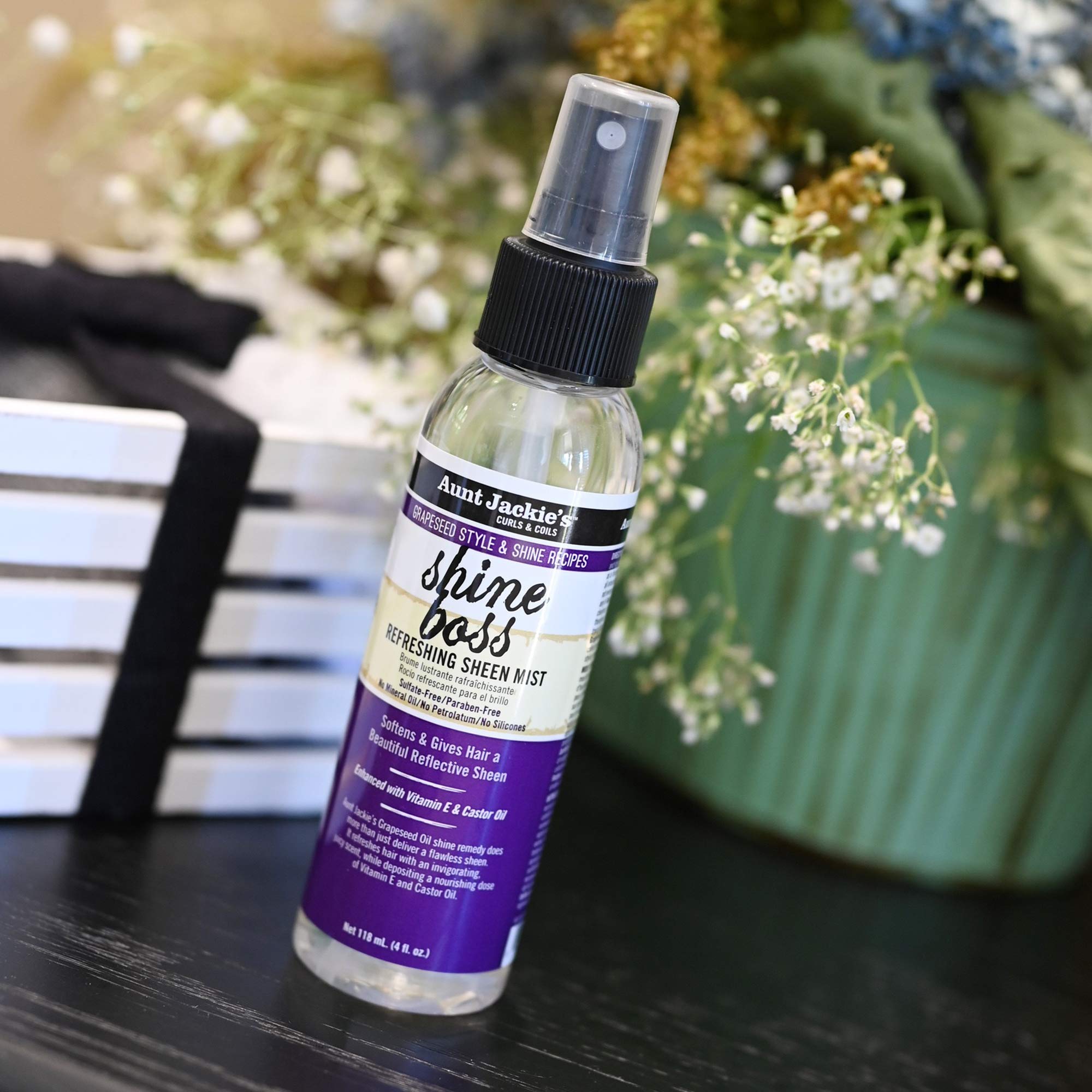 Flacon Shine Boss montrant huile de raisin et vitamine E
