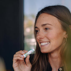 Label highlights 100% organic ingredients like olive oil and beeswax