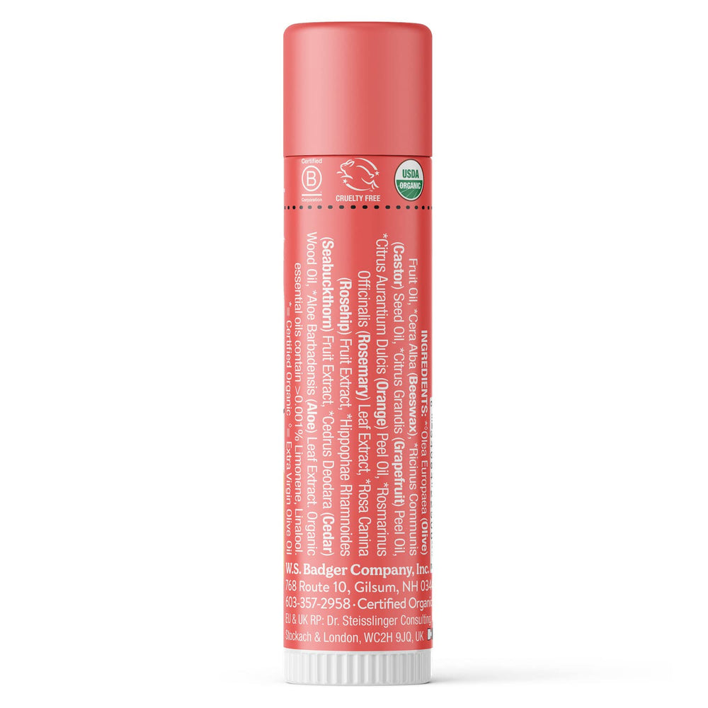 Badger Pink Grapefruit Lip Balm in use, highlighting easy application.