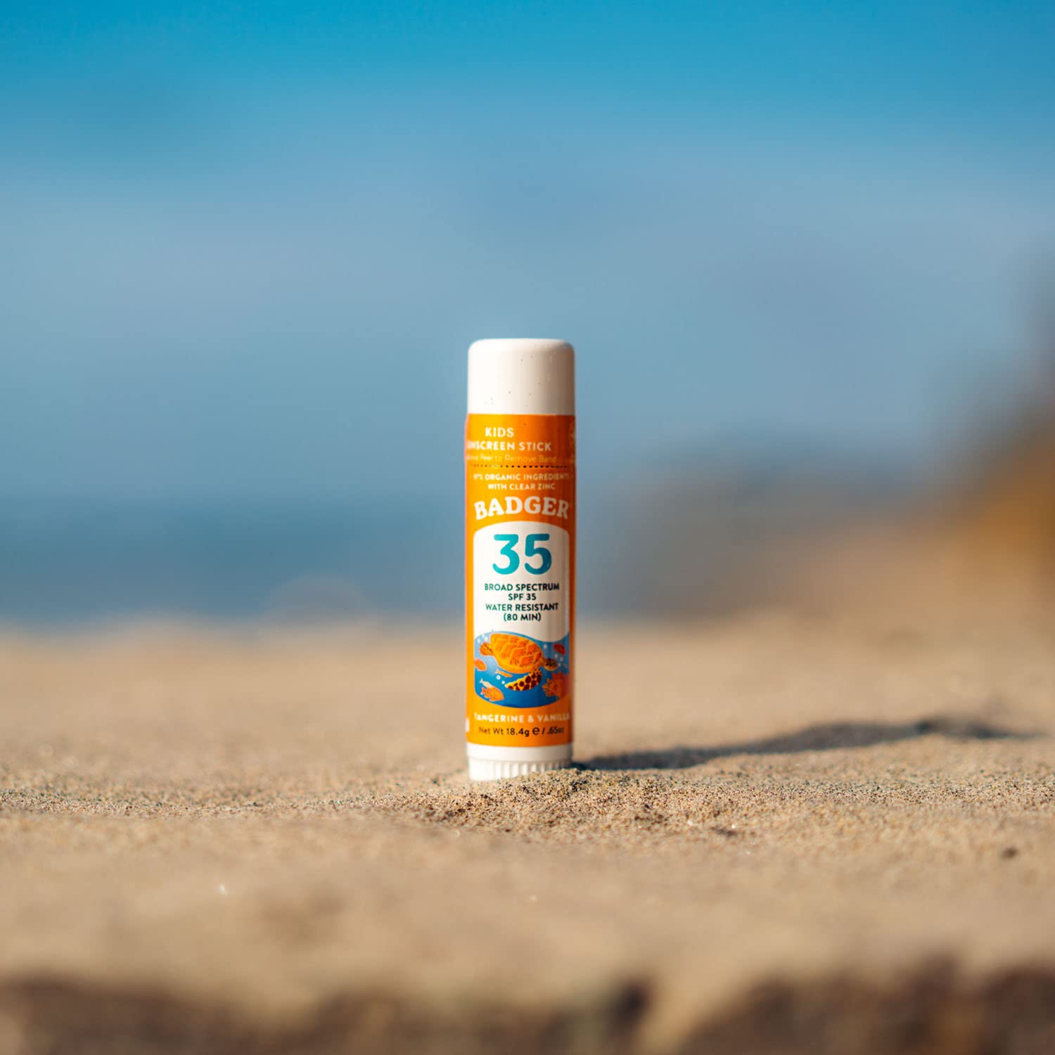 Badger Reef Safe sunscreen stick used near water and beach