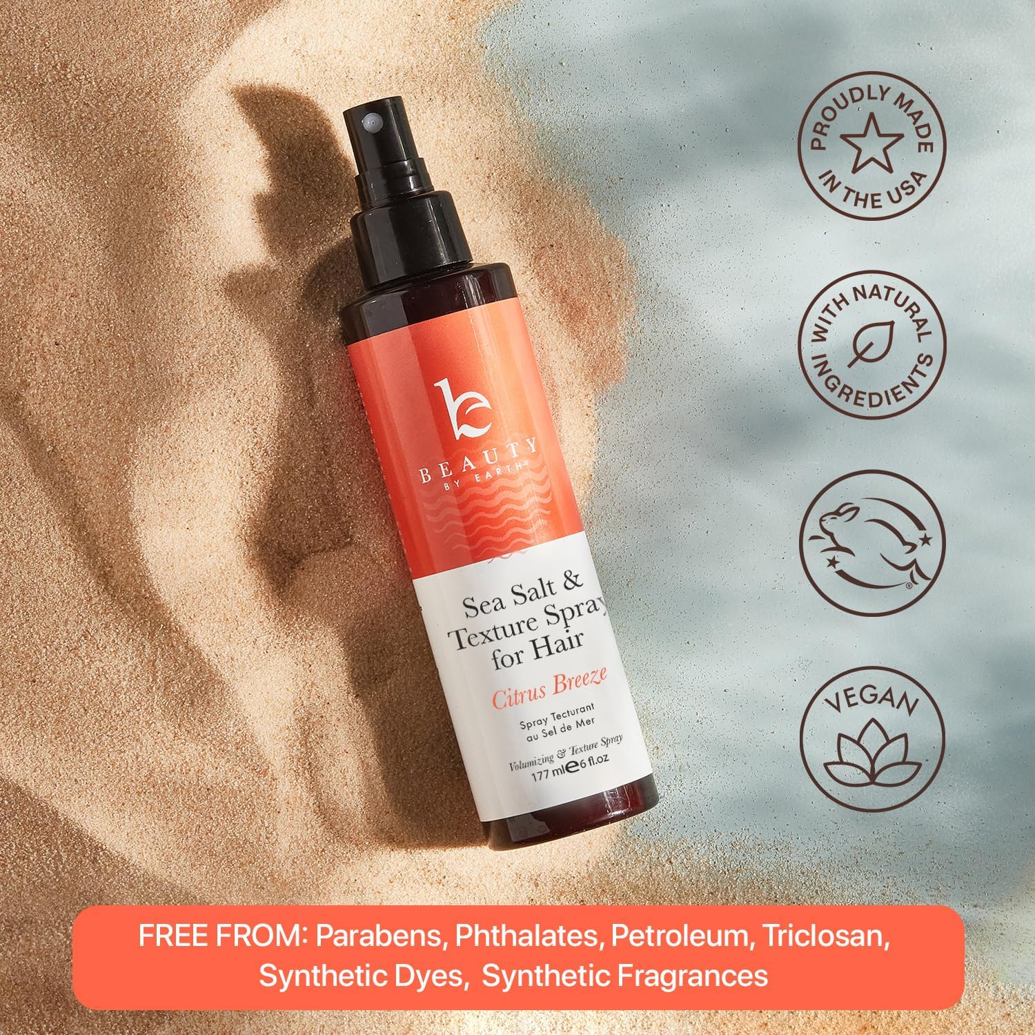 Beauty by Earth Sea Salt Spray user applying for textured look