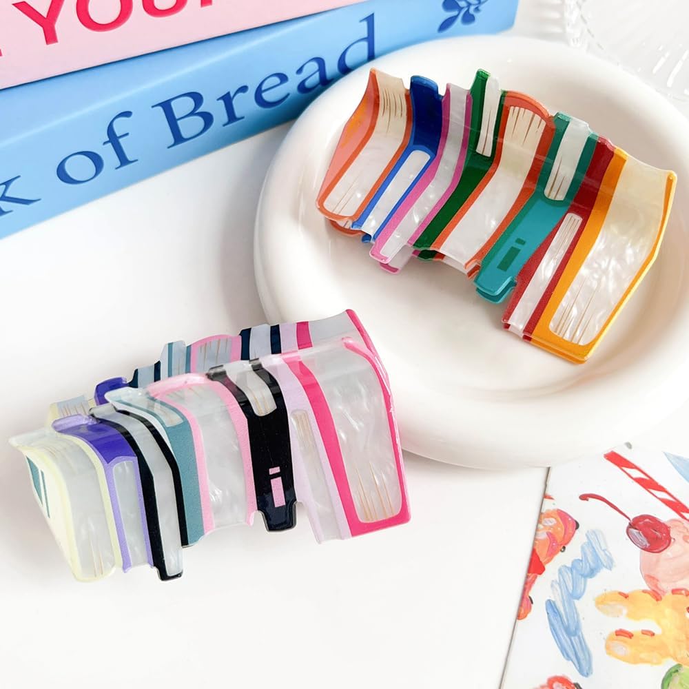 Pince BESALECK livre orange, idéale au quotidien pour coiffure rapide.