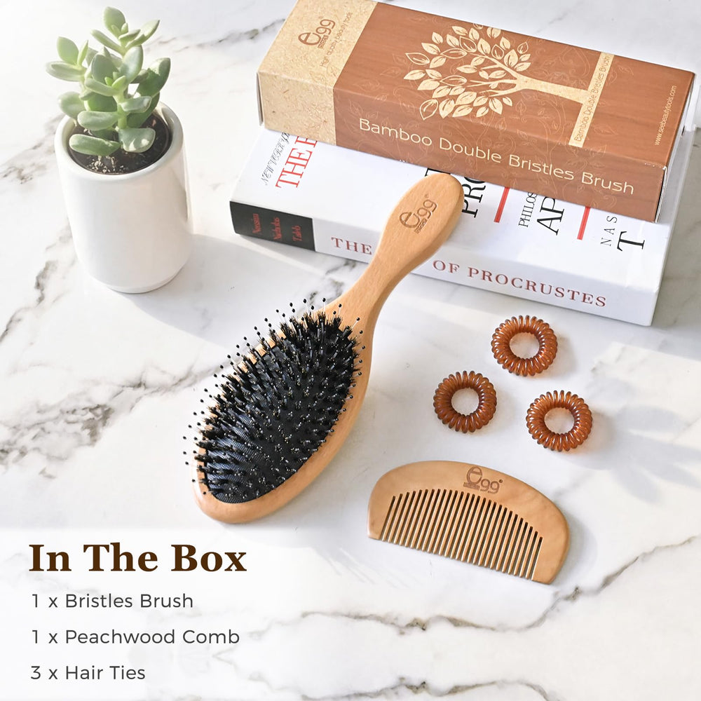 Brosse BLACK EGG polyvalente pour tous types de cheveux.