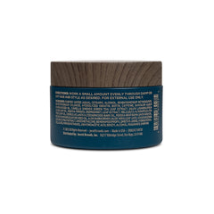Blackstone pomade provides texture for natural, non-greasy styling.