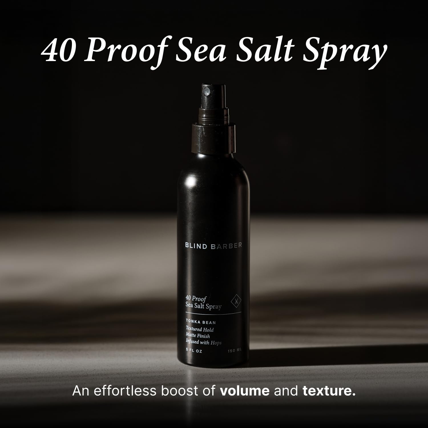 Applying Blind Barber spray to damp hair for lift from roots