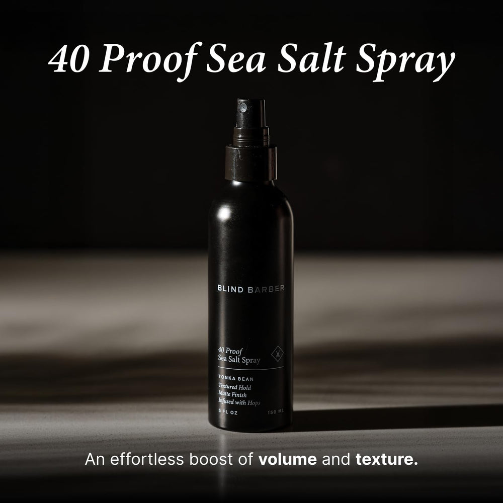 Applying Blind Barber spray to damp hair for lift from roots