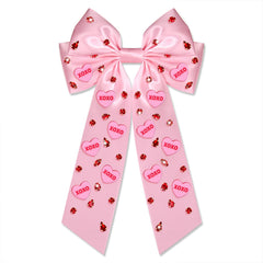 Noeud Boderier satin rose avec coeur XOXO et paillettes, pour un look romantique.