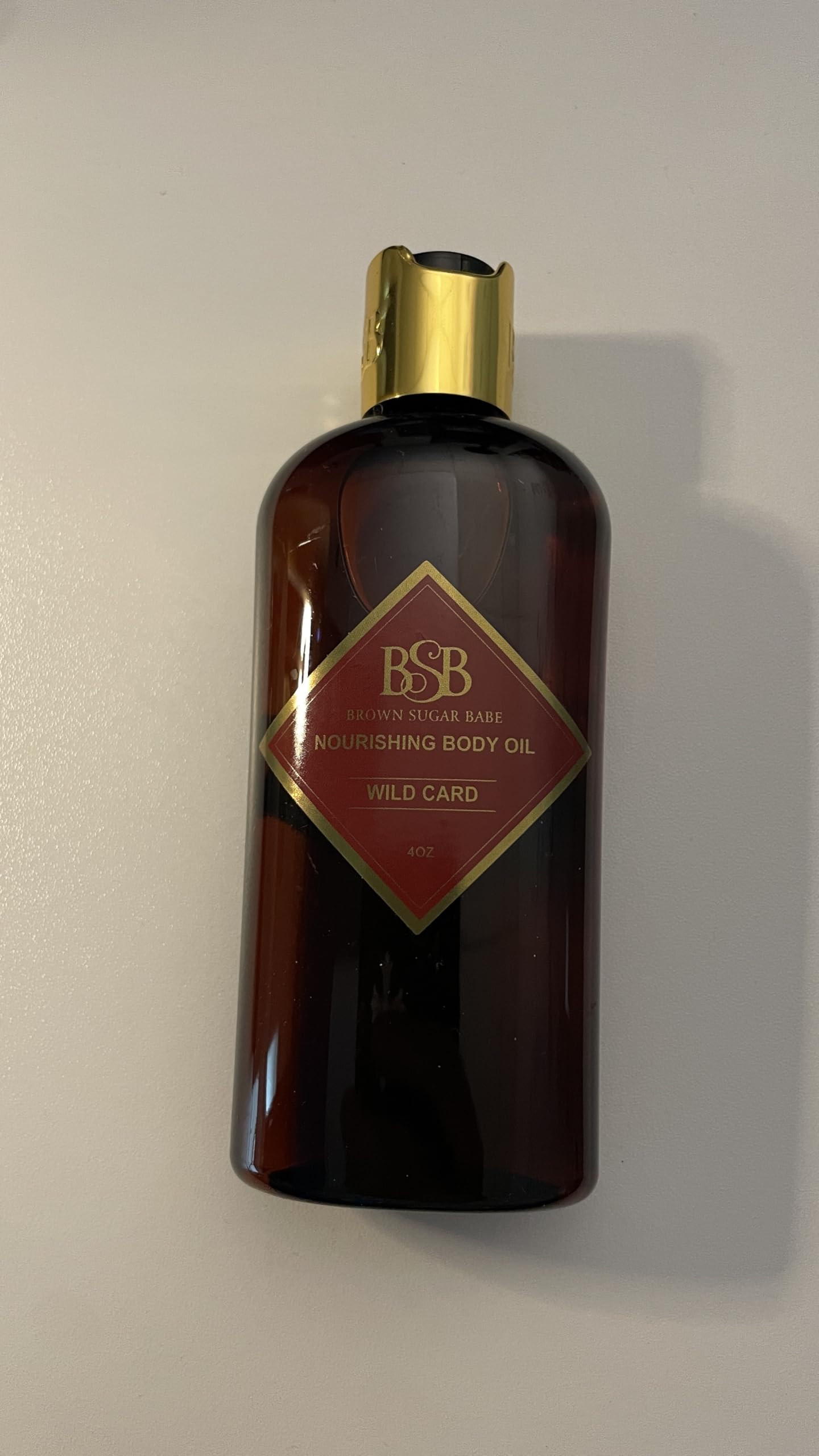 Brown Sugar Babe Wild Card Huile Corps, parfum longue tenue et douceur sur la peau.