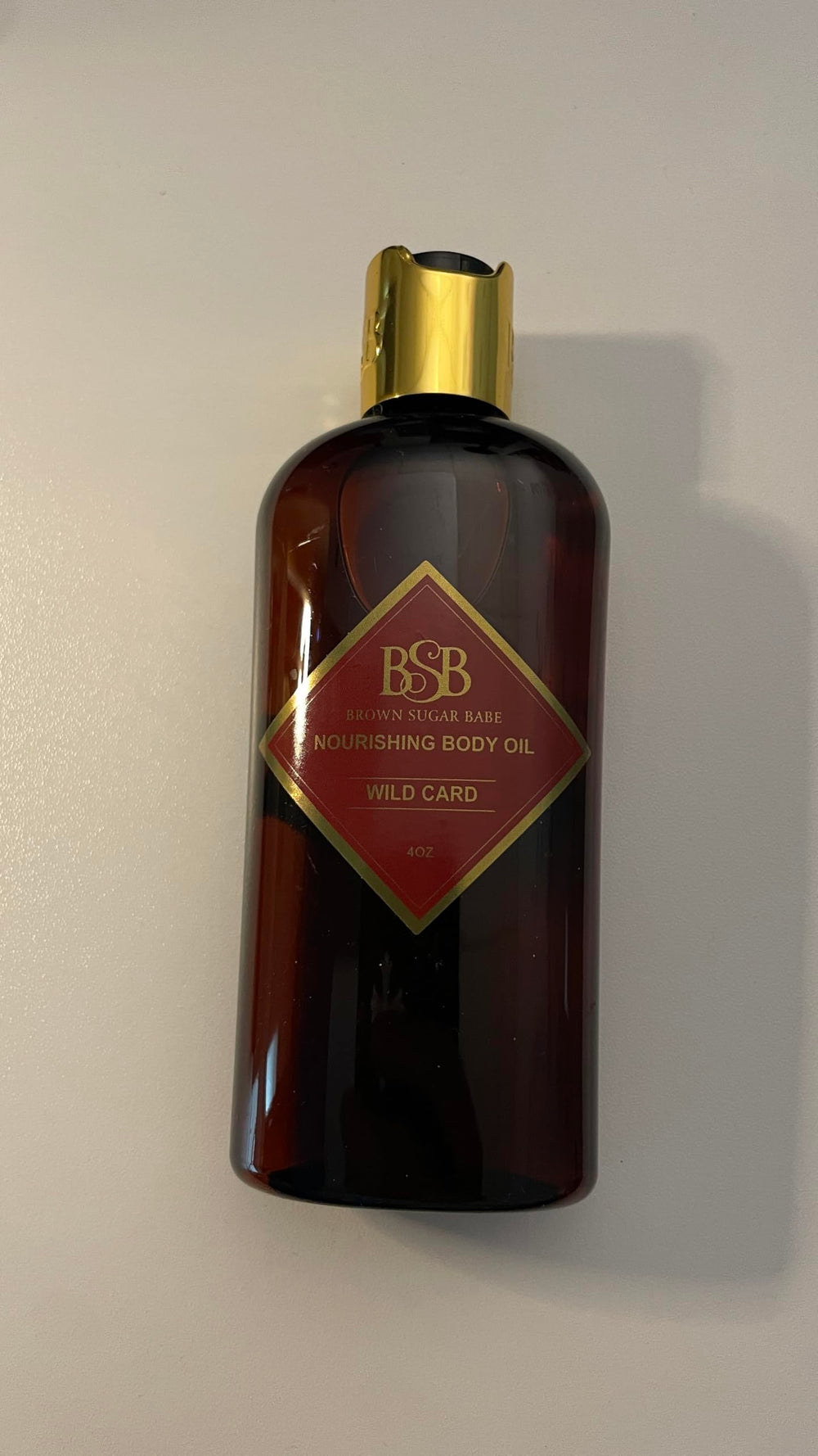 Brown Sugar Babe Wild Card Huile Corps, parfum longue tenue et douceur sur la peau.