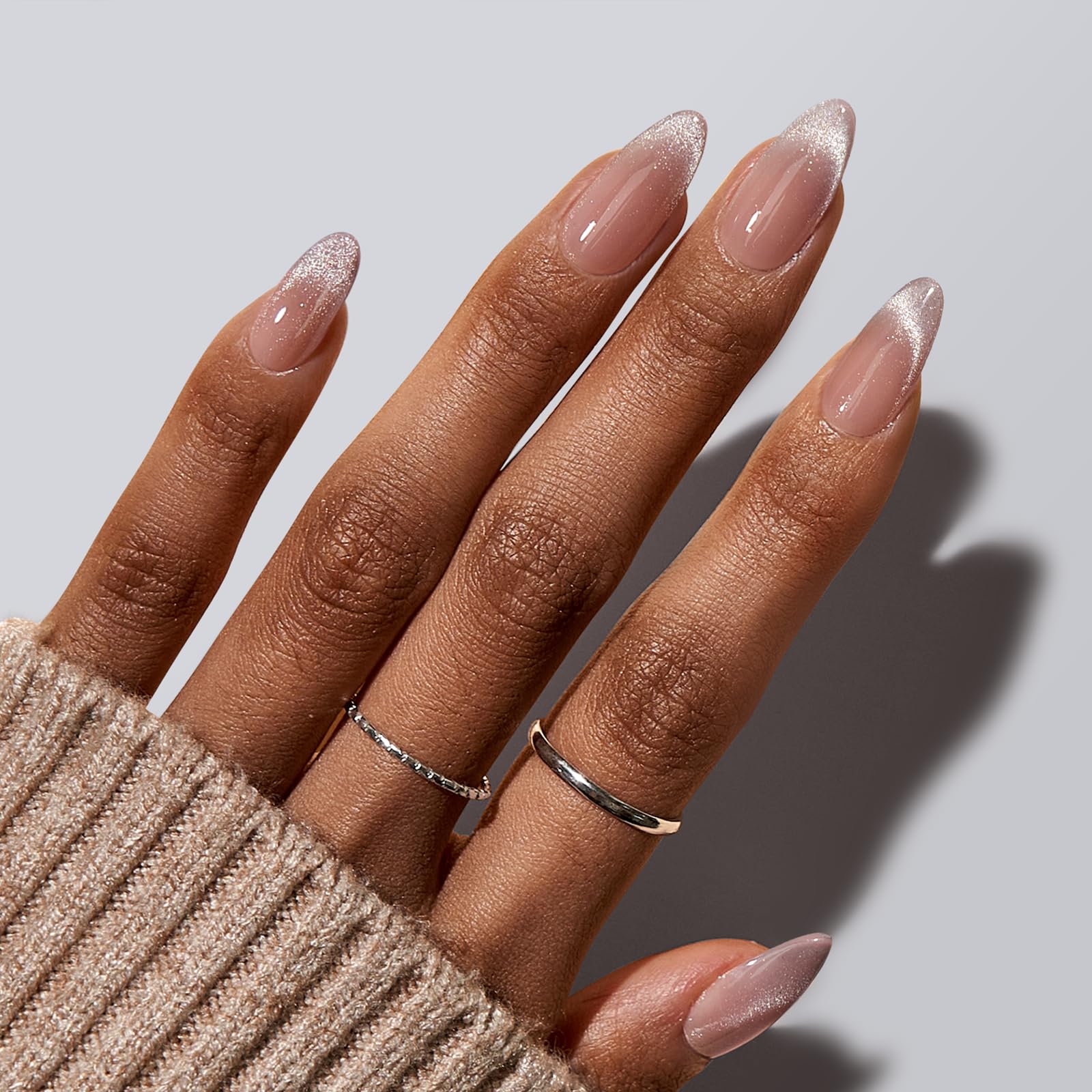 BTArtbox almond nails with cat-eye French tip on hand for at-home manicure.