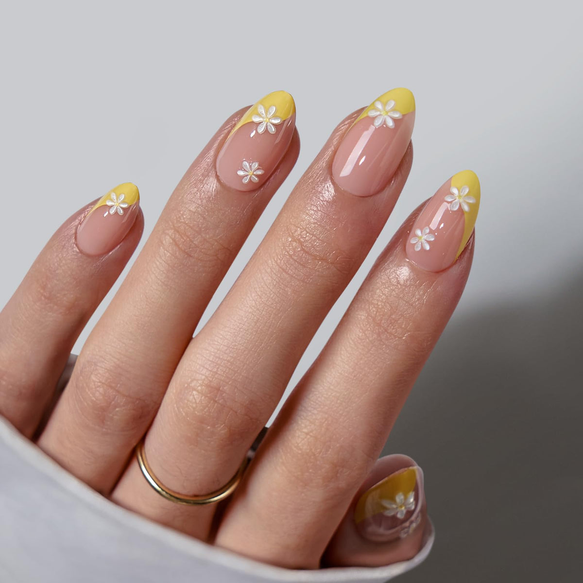 BTArtbox Daisy French-tip press-on nails in almond shape for quick at-home results.
