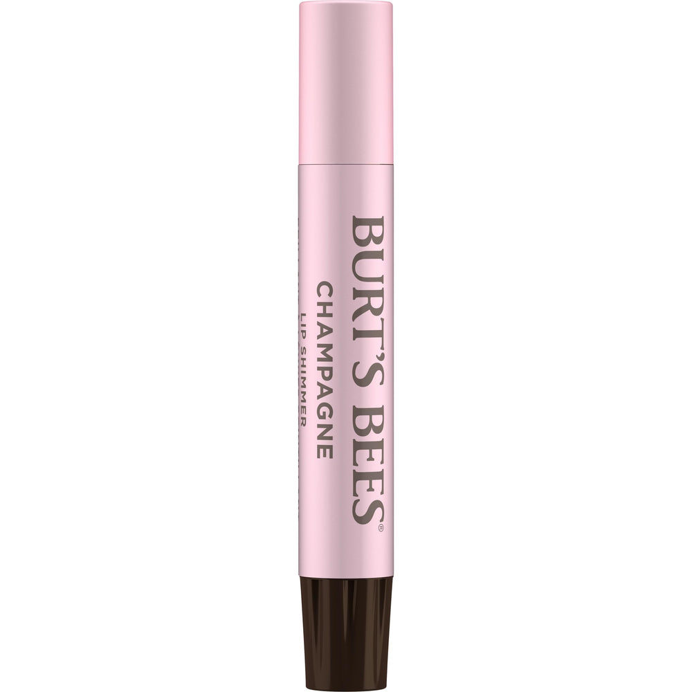 Application Lip Shimmer Champagne sur les lèvres pour un effet gloss léger.