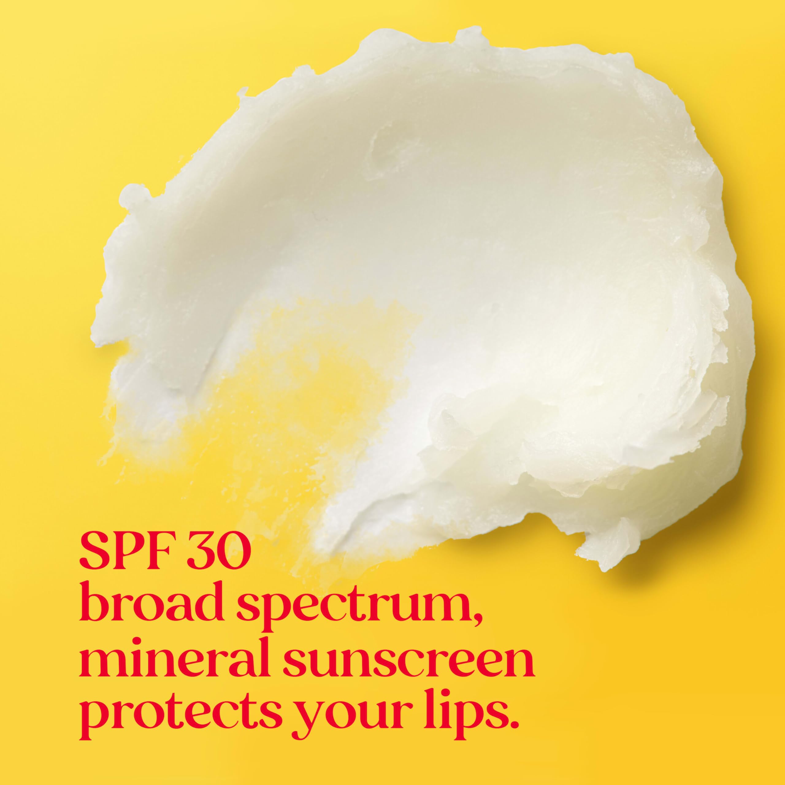 Packaging scene showing Burt's Bees sun care lip balm on a sandy beach.