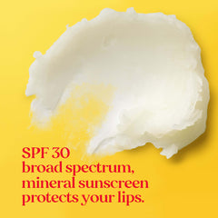 Packaging scene showing Burt's Bees sun care lip balm on a sandy beach.