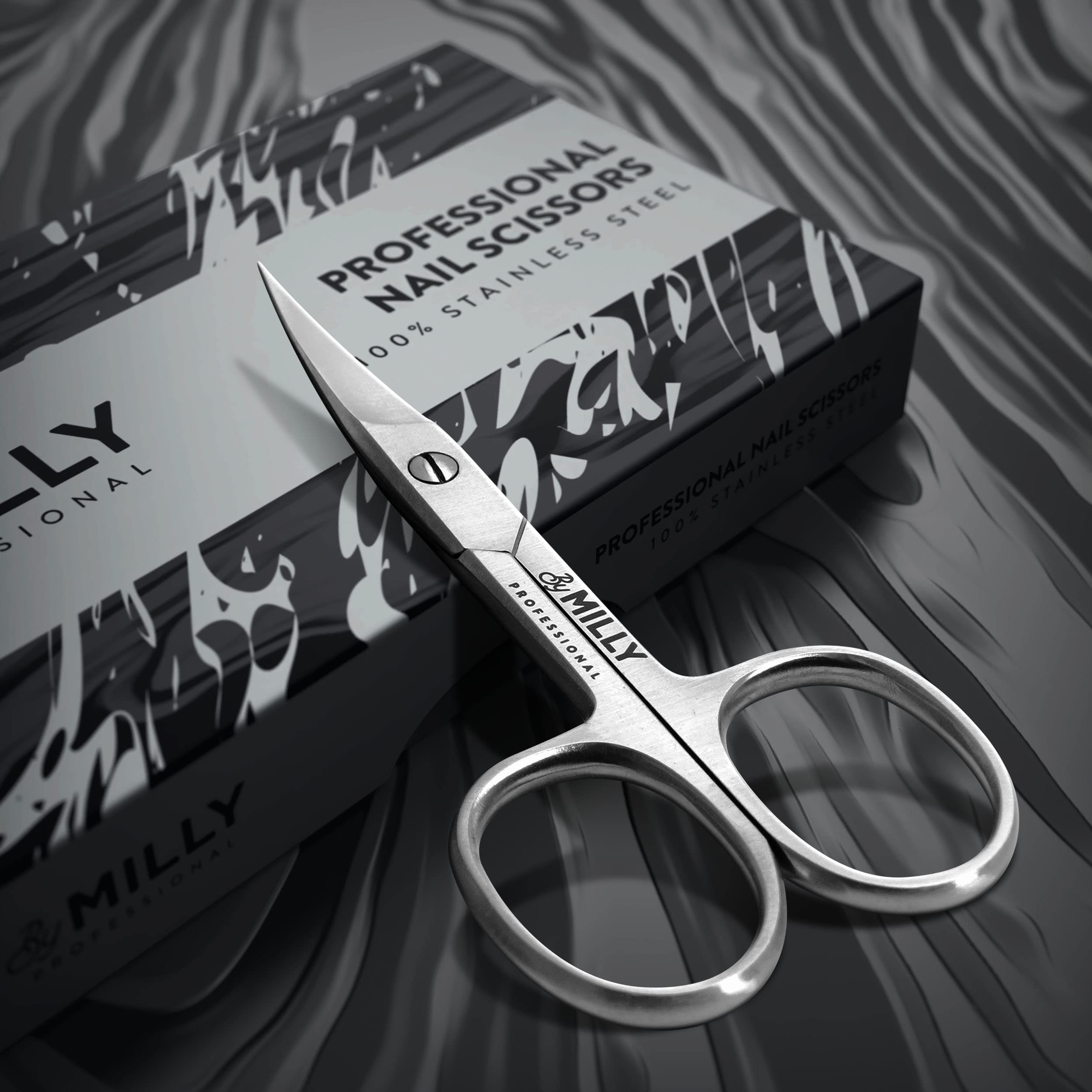 Ciseaux By MILLY avec lame incurvée et pointe fine pour contours des ongles.