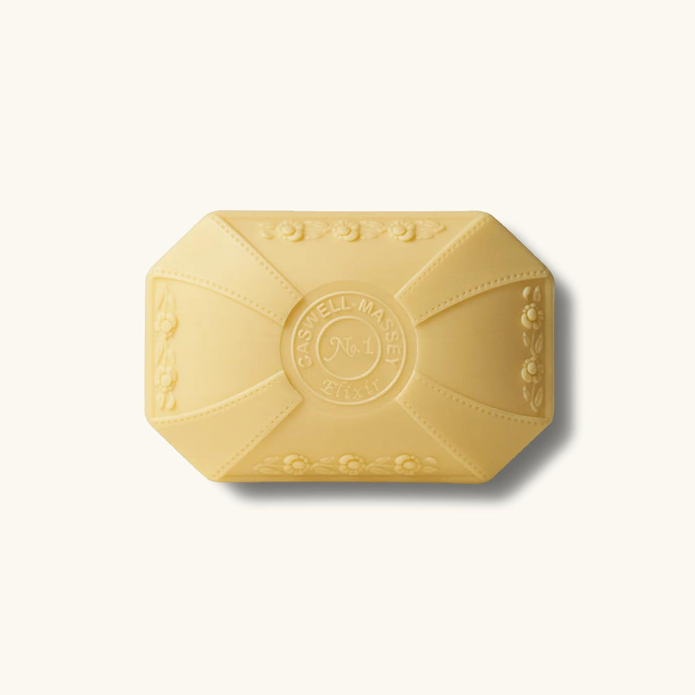 Caswell-Massey Elixir of Love bar soap jasmine and lavender notes visible.