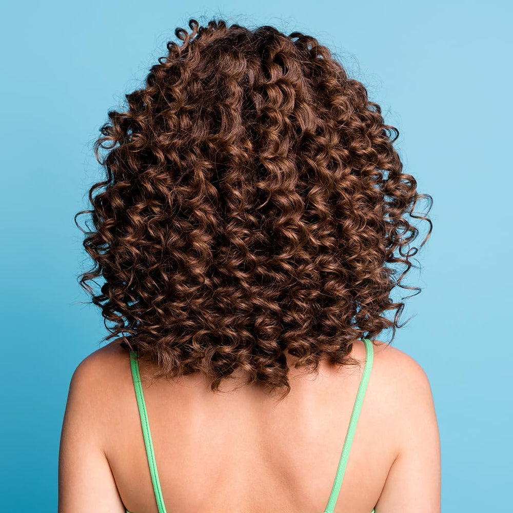 CHI Aloe Vera Curl Reactivating Spray, packaging épuré, idéal pour cheveux bouclés.
