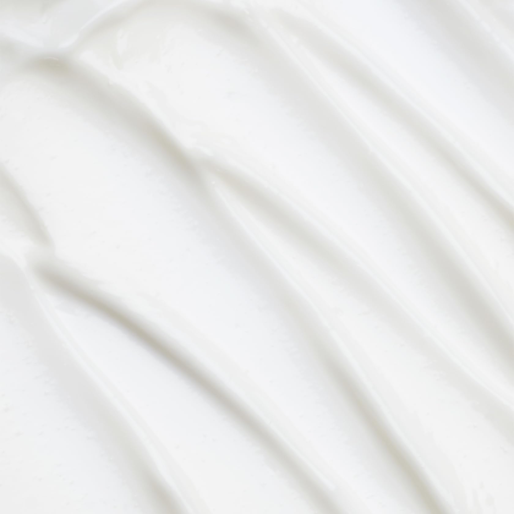 Cocokind Sake Body Lotion being applied for quick absorption and smooth skin.