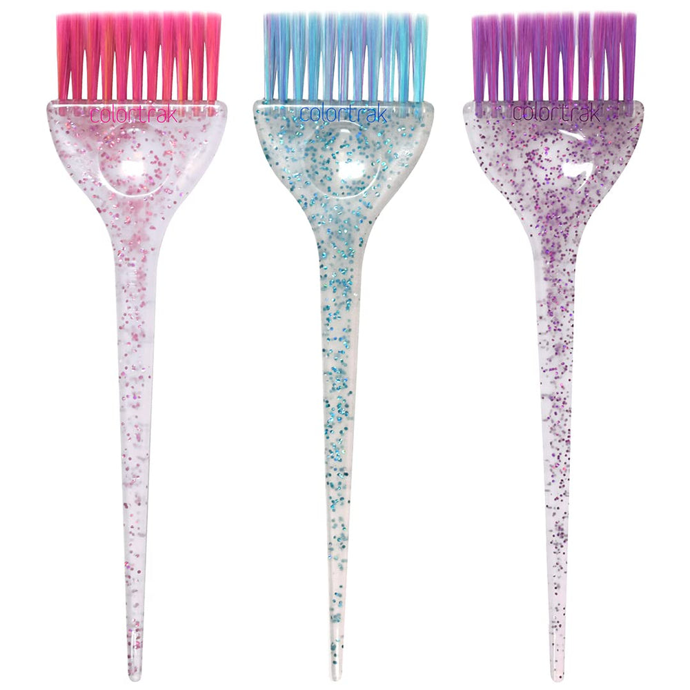 La brosse Colortrak couleur tri-poignees etincelantes rose permet une application précise du colorant.