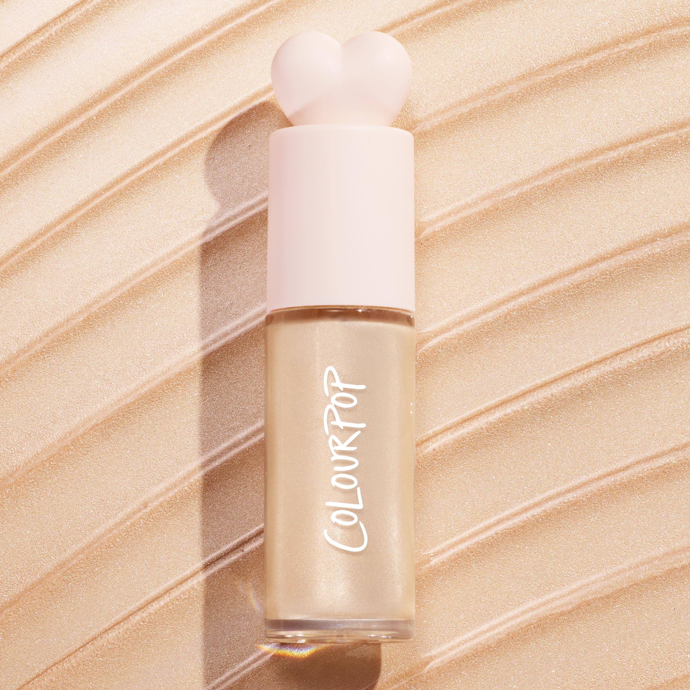 Swatch of ColourPop Hi-Lite on skin showing buildable radiance