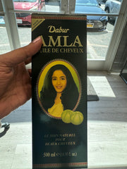 Application facile sur cheveux et cuir chevelu avec massage relaxant Dabur Amla.